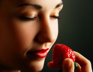 woman holding strawberry