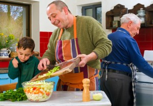 dad, son, and grandfather cooking