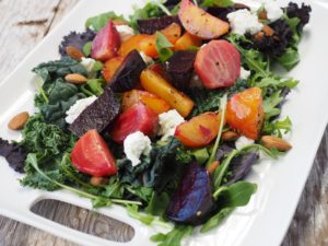 green salad with roasted beets and goat cheese crumbles