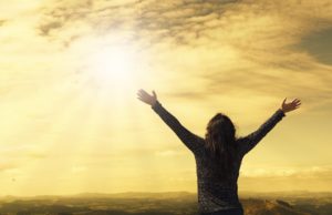 gratful person raising hands