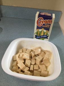 marinated tofu cubes in cornstarch