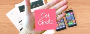 hand with Set Goals note