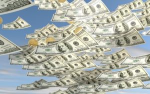 Raining money: American dollar bills and coins from the sky