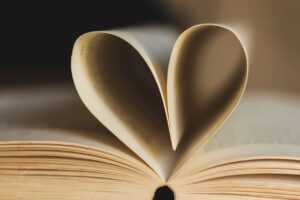 pages of open book shaped into a heart